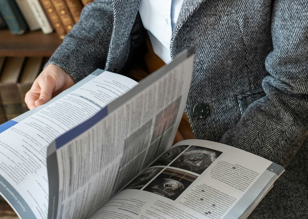 woman reading scientific article
